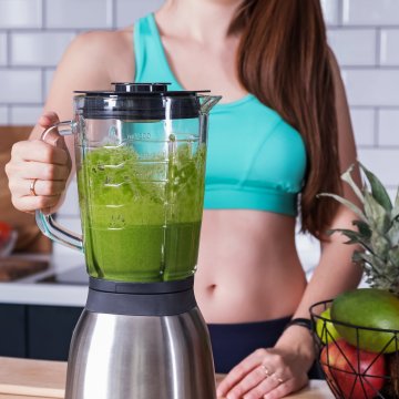 blender green smoothie woman healthy fruit